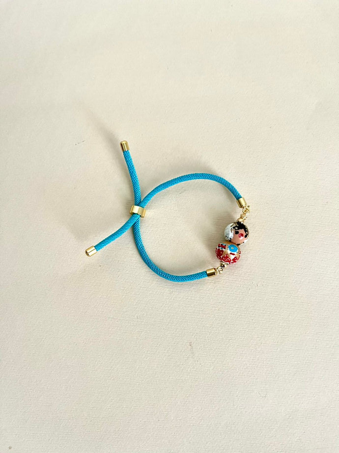 Pulsera de cordón turquesa empollerada roja