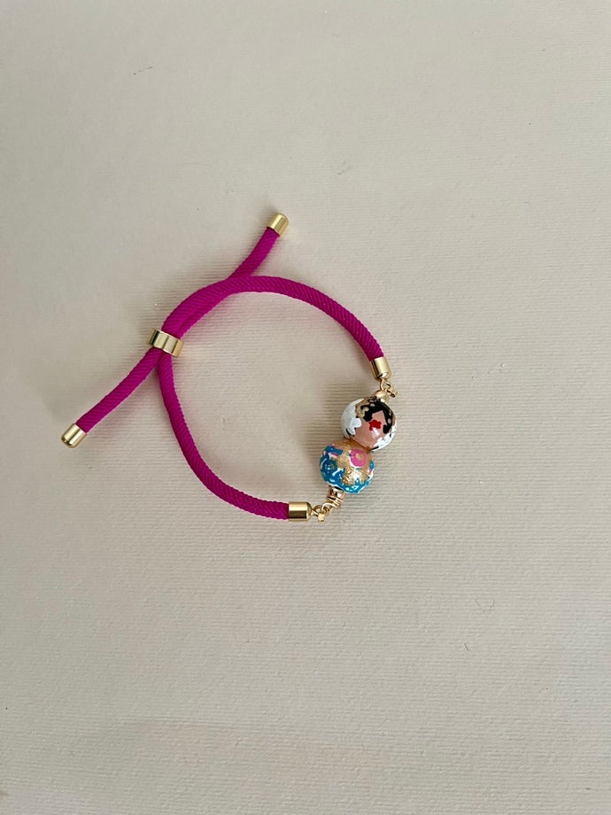 Pulsera de cordón fucsia empollerada turquesa